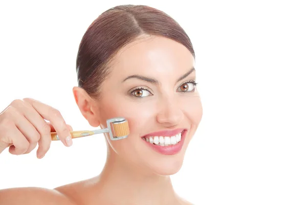 Beauty girl using skin roller. — Stock Photo, Image