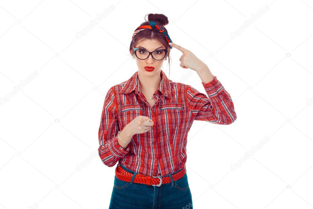 You are really crazy nuts! Portrait unhappy annoyed young woman getting mad pointing finger at you camera showing hand gesture you have to think. Closeup portrait of a beautiful girl in red checkered.
