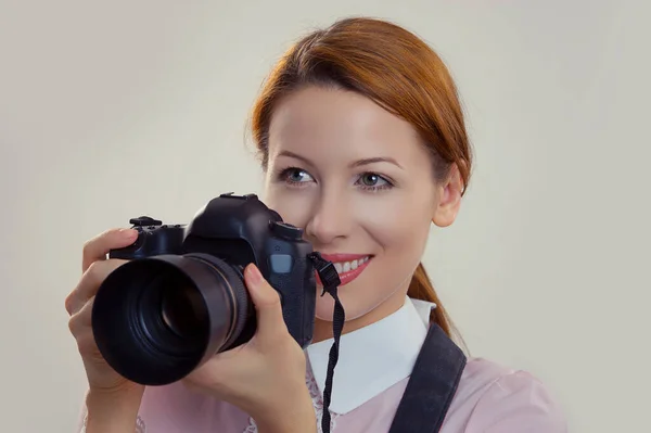 Photographer. Closeup portrait headshot young woman lady girl smiling taking pictures holding dslr camera. Wedding travel photography hobby paparazzi. Mixed race model isolated light green background