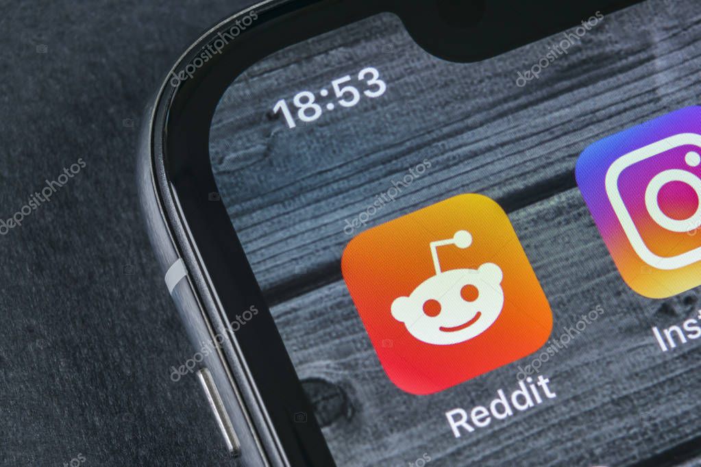 Sankt-Petersburg, Russia, April 12, 2018: Reddit application icon on Apple iPhone X smartphone screen close-up. Reddit app icon. Reddit is an online social media network.