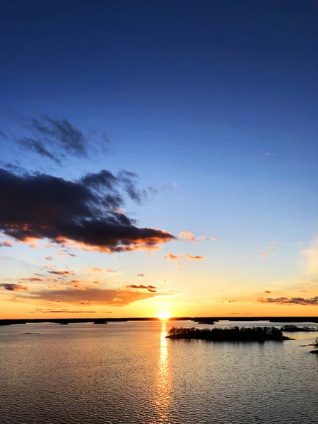 Aerial view of a Sunset sky background. Aerial Dramatic gold sunset sky with evening sky clouds over the sea. Stunning sky clouds in the sunset. Sky landscape. Aerial photography.