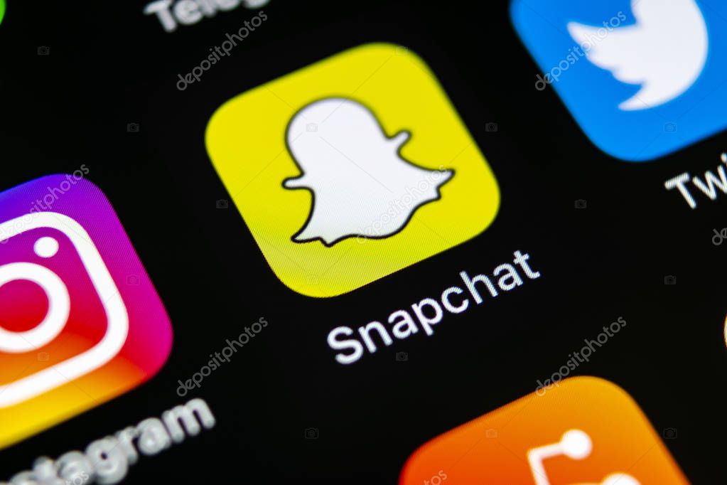 Sankt-Petersburg, Russia, May 10, 2018: Snapchat application icon on Apple iPhone X smartphone screen close-up. Snapchat app icon. Social media icon. Social network