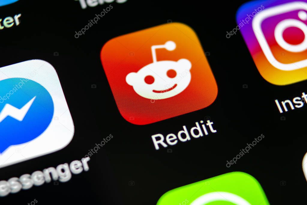 Sankt-Petersburg, Russia, May 10, 2018: Reddit application icon on Apple iPhone X smartphone screen close-up. Reddit app icon. Reddit is an online social media network.