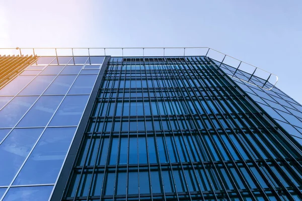 Details of office building exterior. Business buildings skyline looking up with blue sky. Modern architecture apartment. High tech exterior. Reflective buildings. Office Skyscraper. Glass office.