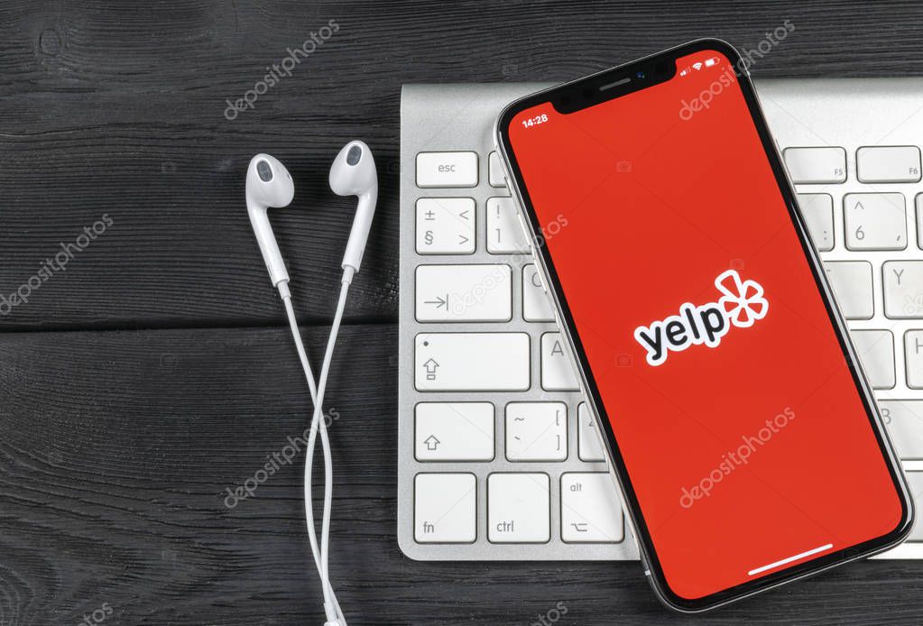 Sankt-Petersburg, Russia, June 2, 2018: Yelp application icon on Apple iPhone X screen close-up. Yelp app icon. Yelp.com application. Social network. Social media