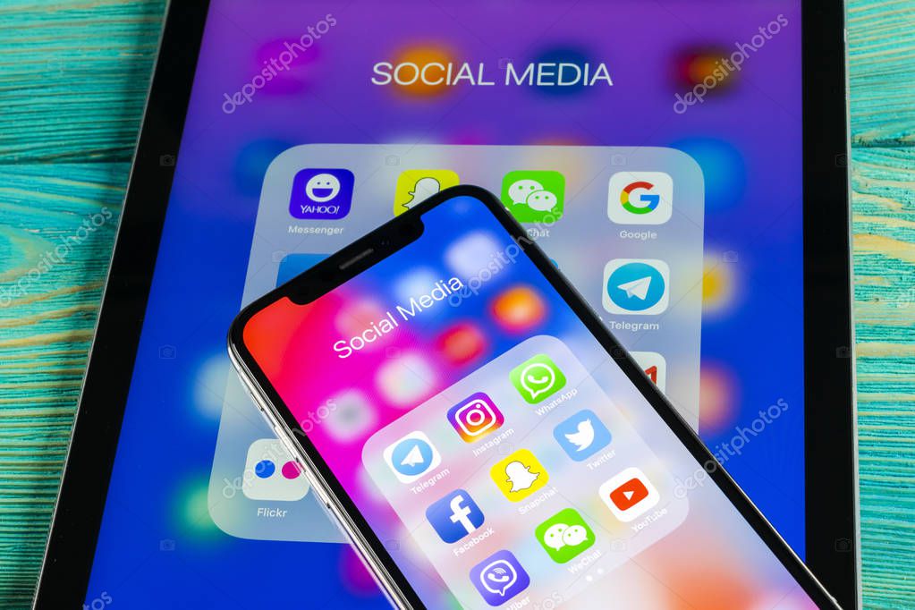 Sankt-Petersburg, Russia June 8, 2018: Apple iPhone X and iPad with icons of social media facebook, instagram, twitter, snapchat application on screen. Social media icons. Social network. Social media
