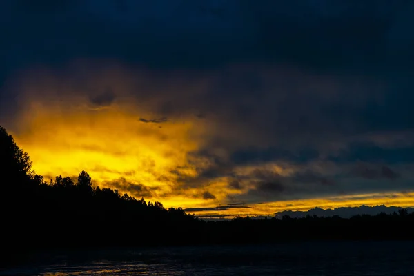 Sunset sky background. Dramatic gold sunset sky with evening sky clouds over the sea. Stunning sky clouds in the sunset. Sky landscape. Panoramic sky view.