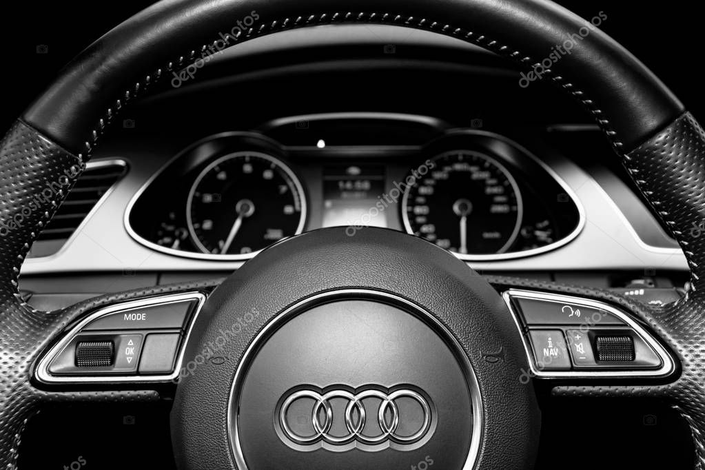 Sankt-Petersburg, Russia, Februaru 20, 2017: Close uo of a Audi A4 S-line steering wheel. Modern car interior details. Speedometer, tachometer. Car dashboard. Black and white