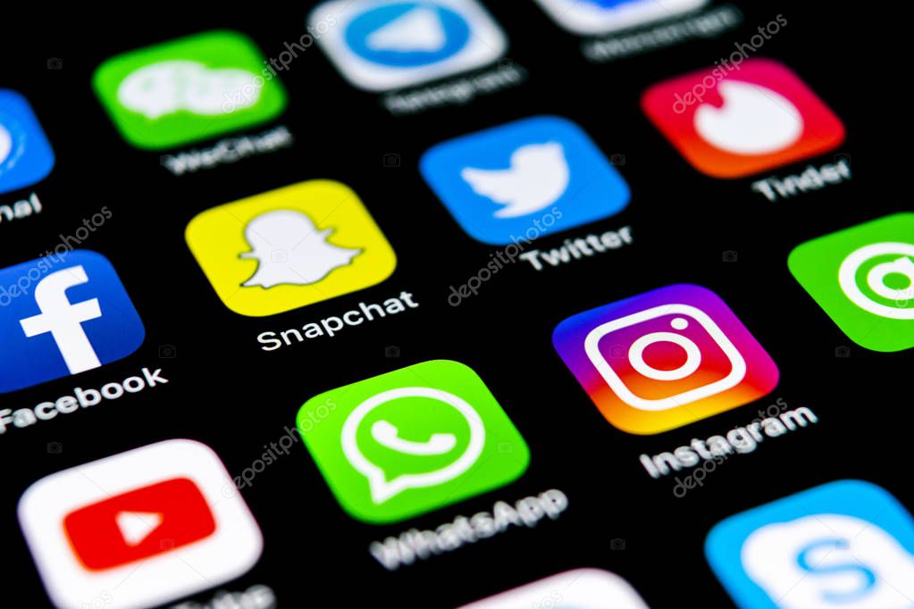 Sankt-Petersburg, Russia, July 29, 2018: Apple iPhone X with icons of social media facebook, instagram, twitter, snapchat, google application on screen. Social media icons. Social network