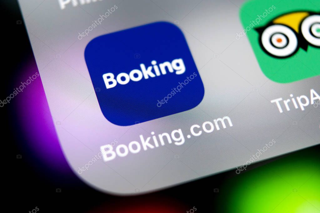 Sankt-Petersburg, Russia, August 10, 2018: Booking.com application icon on Apple iPhone X screen close-up. Booking app icon. Booking.com.  Social media app. Social network