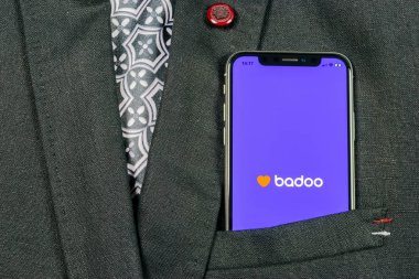Sankt-Petersburg, Russia, August 24, 2018: Badoo application icon on Apple iPhone X screen close-up in jacket pocket. Badoo app icon. Badoo is an online social media network. Social media app clipart