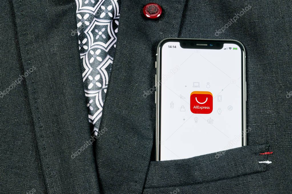 Sankt-Petersburg, Russia, August 24, 2018: Aliexpress application icon on Apple iPhone X smartphone screen in jacket pocket. Aliexpress app icon. Aliexpress.com is popular e-commerce application.