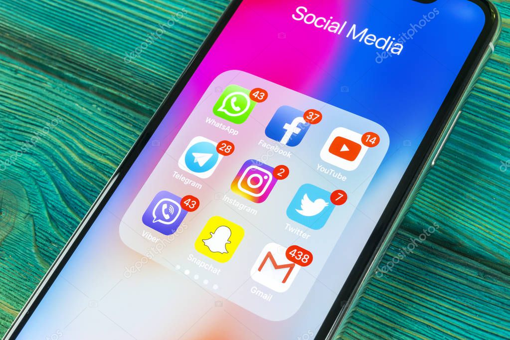 Sankt-Petersburg, Russia, September 2, 2018: Apple iPhone X with icons of social media facebook, instagram, twitter, snapchat, google application on screen. Social media icons. Social network