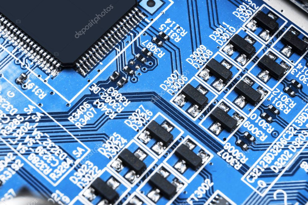 Macro shot of a Circuitboard with resistors microchips and electronic components. Computer hardware technology. Integrated communication processor. Information engineering. Semiconductor. PCB. Closeup