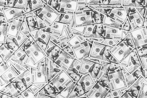 Stack of one hundred dollar bills. Stack of cash money in hundred dollar banknotes. Heap of hundred dollar bills background. Concept of financial success. Black and white. Money backgriund