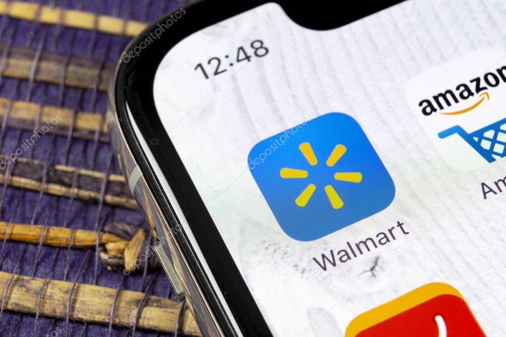 Sankt-Petersburg, Russia, December 5, 2018: Walmart application icon on Apple iPhone X screen close-up. Walmart app icon. Walmart.com is multinational retailing corporation