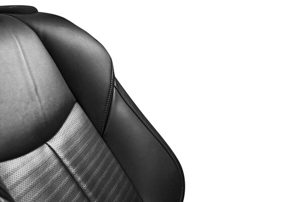 Black leather interior of the luxury modern car. Perforated Leather comfortable seats isolated on white background. Modern car interior details. Car detailing. Car inside