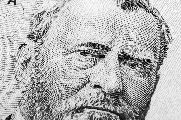 Close up view Portrait of Ulysses S. Grant on the one fifty dollar bill. Background of the money. 50 dollar bill with Ulysses S. Grant eyes macro shot. Money background. Face portrait. Black and white