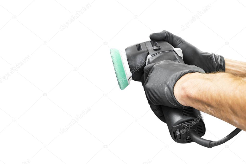 Car polish wax worker hands holing polishing tools isolated on white background. Buffing and polishing car concept. Man holds a polisher in the hand and polishes. 
