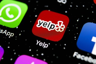 Sankt-Petersburg, Russia, February 3, 2019: Yelp application icon on Apple iPhone X screen close-up. Yelp app icon. Yelp.com application. Social network. Social media clipart