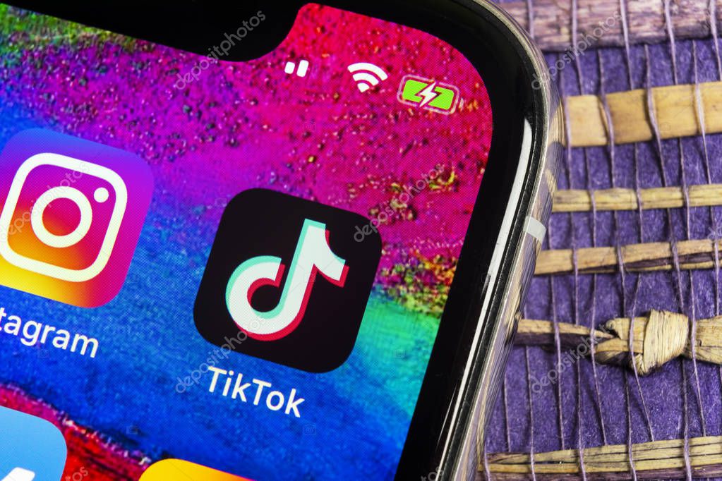 Helsinki, Finland,  February 17, 2019: Tik Tok application icon on Apple iPhone X screen close-up. Tik Tok icon. tik tok application. Tiktok Social media network. Social media icon