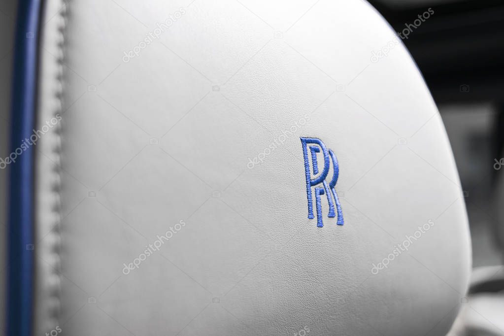 Monte-Carlo, Monaco, February 24, 2019: The new Rolls Royce Cullinan logo in white perforated leatherseat interior. Rolls-Royce Cullinan luxury SUV. Rolls Royce logo