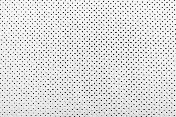 Modern luxury Car white leather interior.  Part of perforated leather car seat details. White Perforated leather texture background. Texture, artificial leather with stitching. Comfortable perforated leather seats