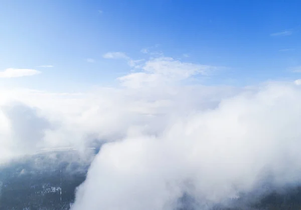 Aerial view White clouds in blue sky. Top view. View from drone. Aerial bird\'s eye view. Aerial top view cloudscape. Texture of clouds. View from above.