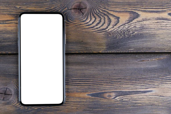 Smartphone ile boş perde kadar sahte. Smartphone izole ekran kırpma yoluyla. Cep telefonu beyaz ekran ile kopya alanı ofis masasında. Metin için boş yer. İzole beyaz ekran