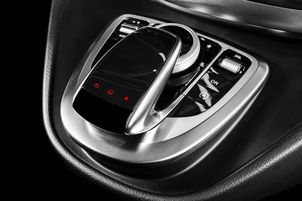 Media and navigation control buttons of a Modern car. Car interior details. Brown leather interior with stitching of the luxury modern car. Modern car interior. Car detailing. Black and white — Stock Photo, Image