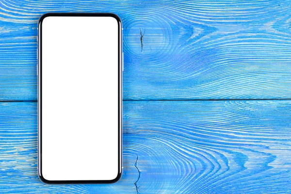 Smartphone with blank screen mock up. Smartphone isolated screen with clipping path. Mobile phone white screen with copy space on office desk. Empty space for text. Isolated white screen