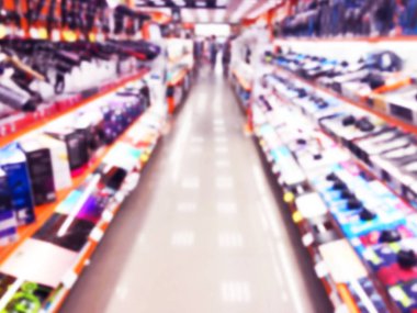 Alışveriş merkezinde mobil mağaza butik ile soyut bulanıklık arka plan. Bokeh ışık bulanık arka plan ile Eletronic mağaza iç. Deodaklanmış bulanıklık arka plan. Bulanık iç görünüm perakende mağazası