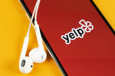 Yelp application icon on Apple iPhone X screen close-up. Yelp app icon. Yelp.com application. Social network. Social media clipart