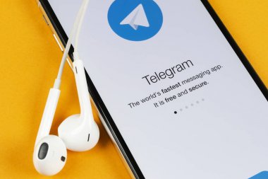 Telegram application icon on Apple iPhone X screen close-up. Telegram app icon. Telegram is an online social media network. Social media app clipart