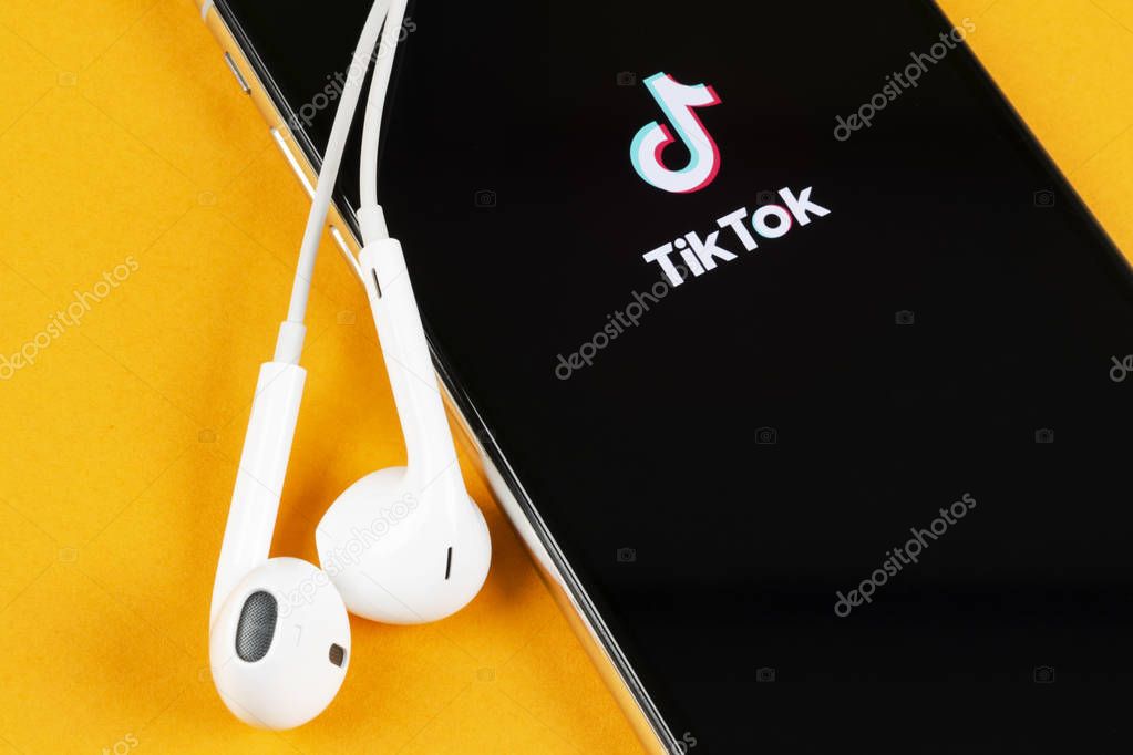 Helsinki, Finland,  May 4, 2019: Tik Tok application icon on Apple iPhone X screen close-up. Tik Tok icon. tik tok application. Tiktok Social media network. Social media icon