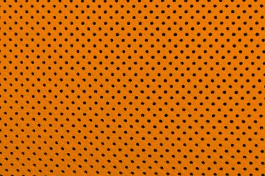 Modern lüks Araba turuncu deri iç. Delikli deri oto koltuğu detaylarının bir parçası. Kahverengi Delikli deri doku arka plan. Doku, dikişli suni deri. Rahat delikli deri koltuklar