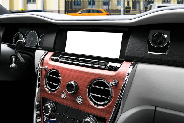Monitor in car with isolated blank screen use for navigation mapMonitor in car with isolated blank screen use for navigation maps and GPS. Isolated on white with clipping path. Car detailing. Car display with blank screen. Modern car interior details
