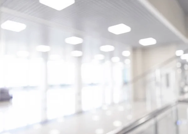 Abstract blur shopping mall corridor. Blurred retail and hall interior in department store. Defocused bokeh effect background or backdrop for business concept. Bokeh light — Stock Photo, Image