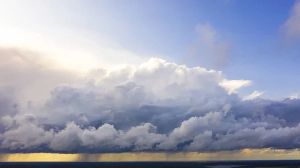 Aerial image of dark Storm clouds over the land. Aerial panorama of storm clouds. Panorama of thunder clouds. View from drone. Aerial bird\'s eye view. Aerial top view cloudscape. Texture of clouds.