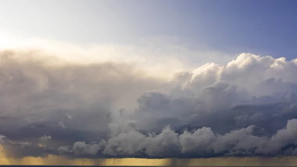 Aerial image of dark Storm clouds over the land. Aerial panorama of storm clouds. Panorama of thunder clouds. View from drone. Aerial bird\'s eye view. Aerial top view cloudscape. Texture of clouds.