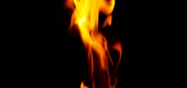 Fire texture isolated on black background. Fire flames on black background. Fire patterns. Texture of flames throughout the space. Red flames up close. The background with flames of fire — Stock Photo, Image