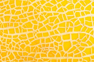 Olgun tatlı kavun arkaplanı. Olgun taze kavun ve meyve ezmesi dokusuna yakın. Sarı kavun desenli arka plan. Karpuzsuz doku