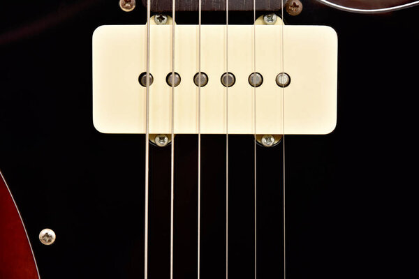Pickup six string electric guitar close-up