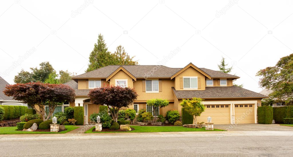 Beautiful Home exterior with fully landscape yard and trees 