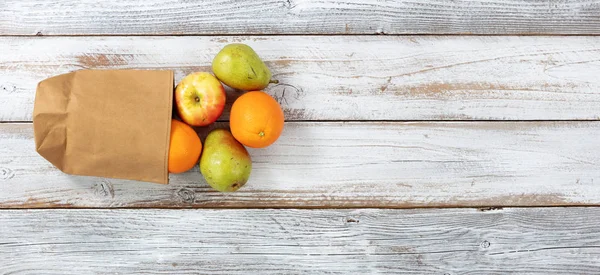 Fresh Organic Fruit Pouring Out Recyclable Paper Bag White Rustic — Stock Photo, Image