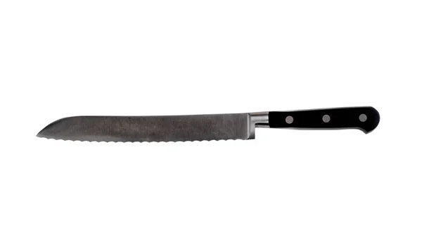 New serrated steel kitchen knife isolated on a pure white backgr — Stock Photo, Image