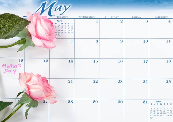 Mothers Day holiday date marked on calendar with pink roses