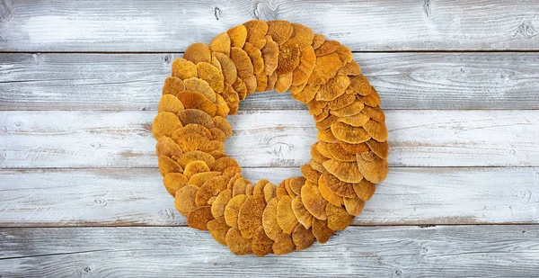 Wreath made of natural fungi or mushroom on white rustic wood — Stock Photo, Image