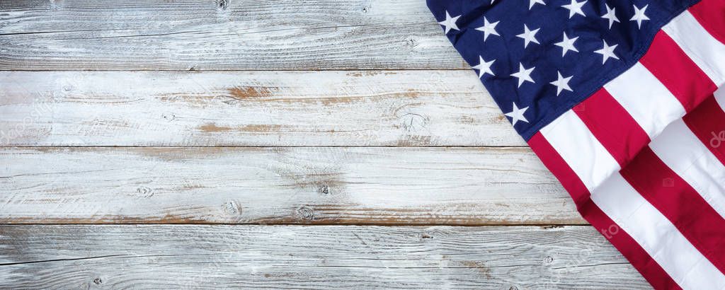 United States flag of America on white rustic wooden background 