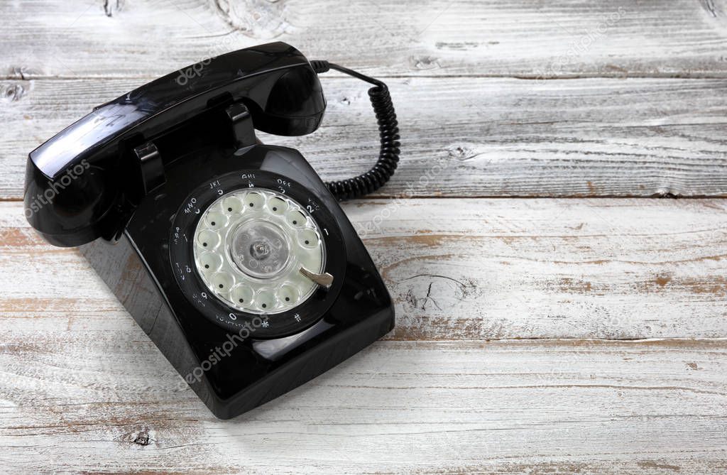 Old fashion rotary dial phone for antique technology concept in 